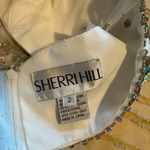 Sherri Hill White Gown with Sleeveless Design and Mandarin Collar